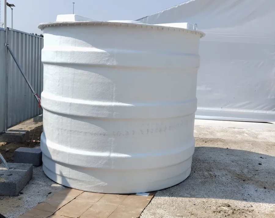 Vertical ribbed GRP water tank placed on a prepared base at a UAE site